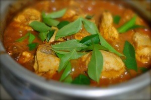 nadan chicken curry - add curry leaves and coconut bits