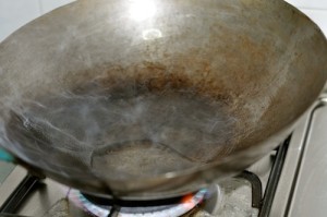 heat oil in wok