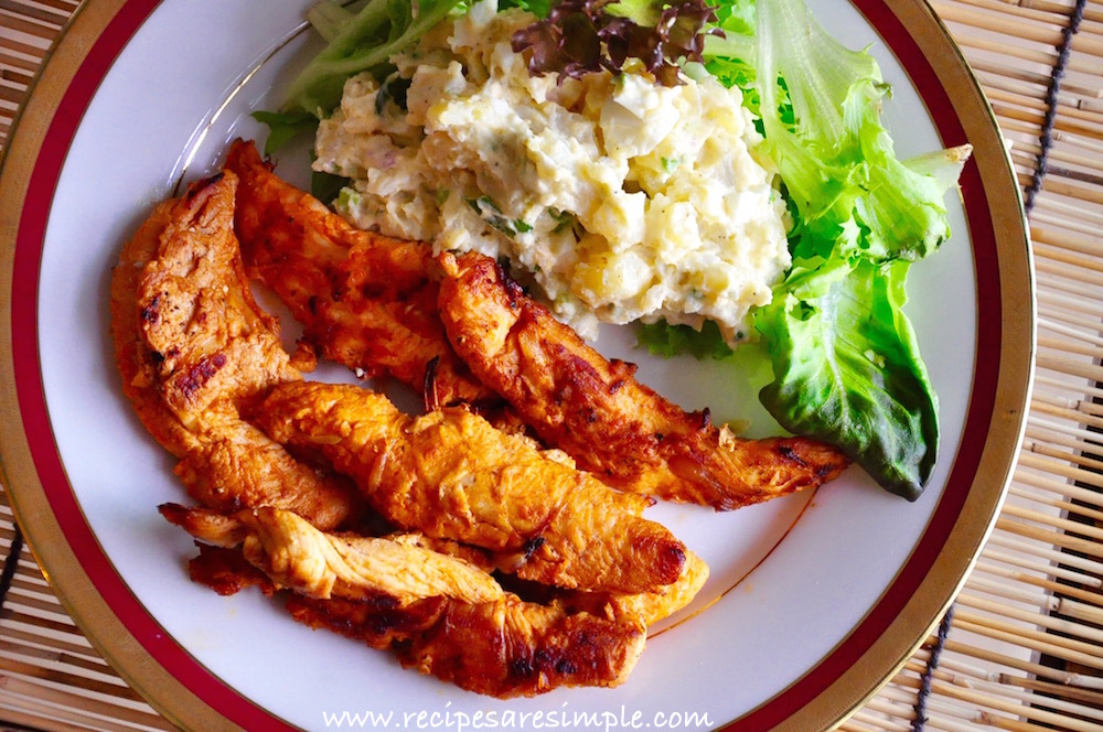 smoky grilled chicken tenders with potato salad meal